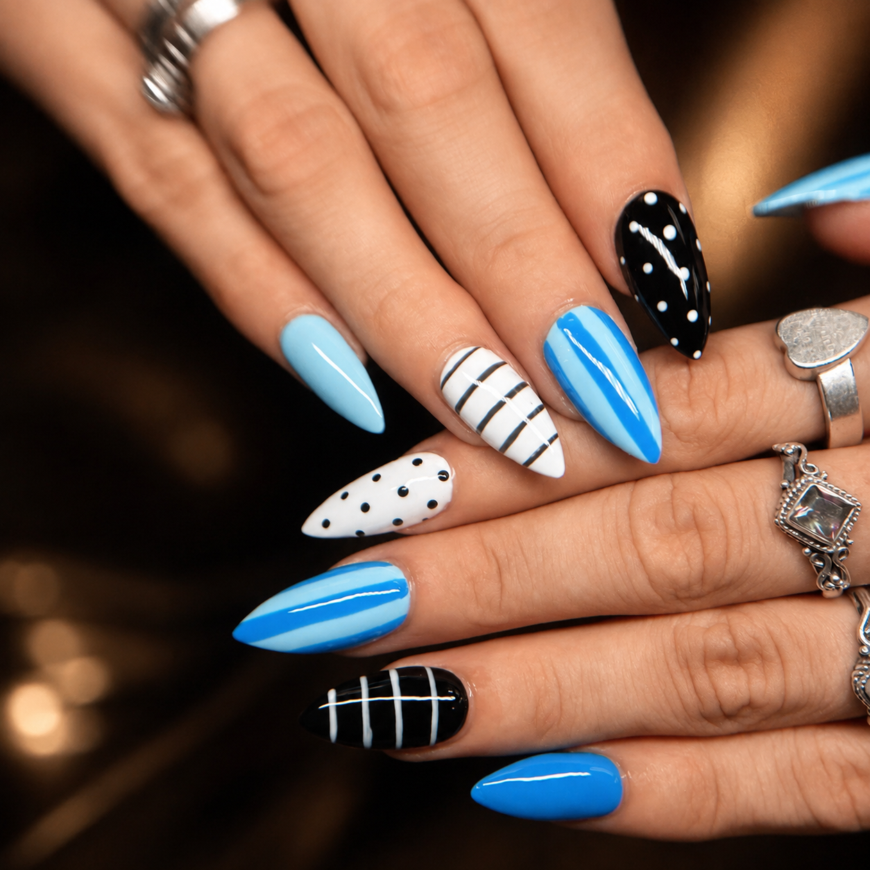 Blue, black and white graphic nail art by Nail Lit